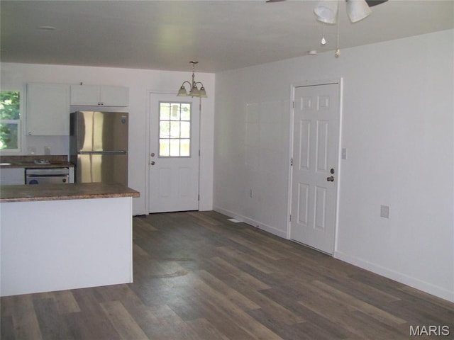 243 Jones St, Sullivan, MO 63080 - kitchen featuring appliances with stainless steel finishes, dark wood finished floors, a chandelier, white cabinetry, and ceiling fan