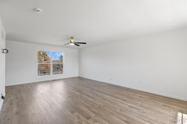 347 Heather Mill Dr, Wentzville, MO 63385 - empty room featuring wood finished floors, a ceiling fan, and a smoke detector