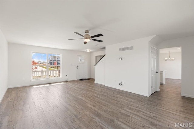 347 Heather Mill Dr, Wentzville, MO 63385 - unfurnished living room featuring a chandelier, wood finished floors, and a ceiling fan
