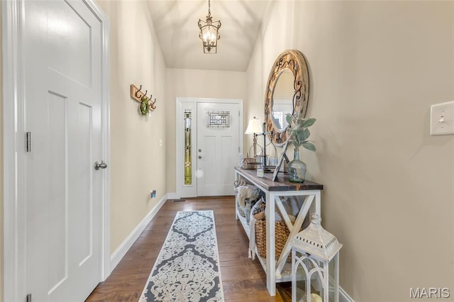 222 Austin Oaks Dr, Moscow Mills, MO 63362 - foyer entrance featuring dark wood-style flooring and vaulted ceiling