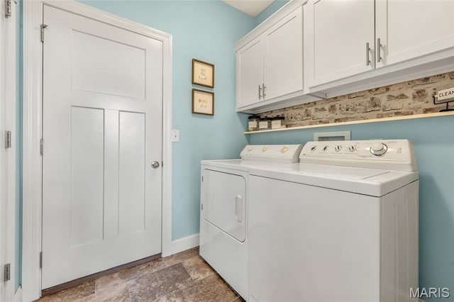 222 Austin Oaks Dr, Moscow Mills, MO 63362 - washroom with cabinet space, washer and clothes dryer, and stone finish floors