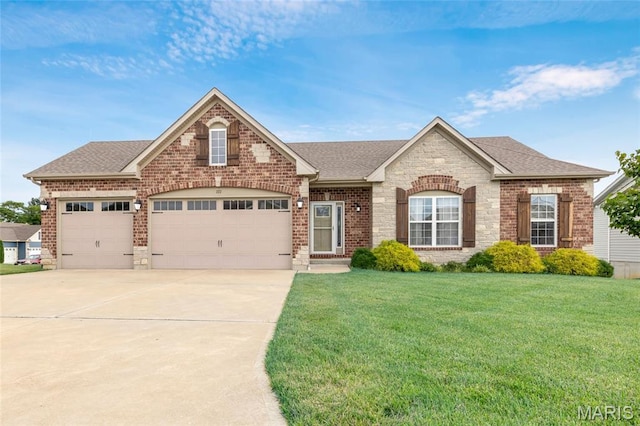 222 Austin Oaks Dr, Moscow Mills, MO 63362 - view of front of house featuring concrete driveway, a front yard, an attached garage, roof with shingles, and brick siding