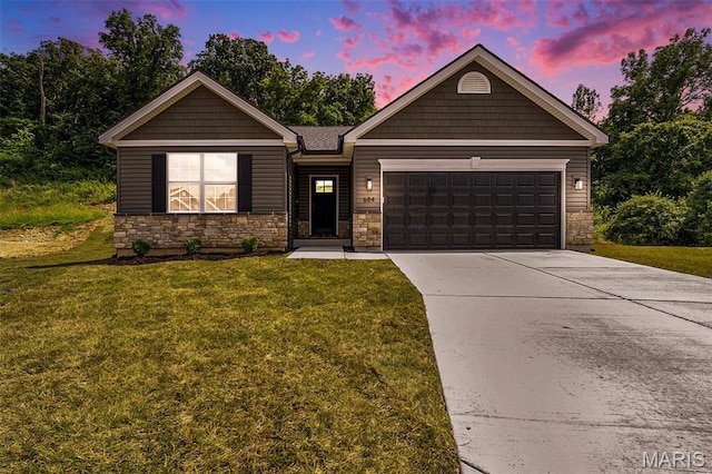 684 Fox Creek Dr, Fenton, MO 63026 - view of front of property featuring a front yard, a garage, concrete driveway, and stone siding