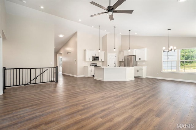 684 Fox Creek Dr, Fenton, MO 63026 - unfurnished living room with high vaulted ceiling, ceiling fan, a chandelier, dark wood-style flooring, and recessed lighting