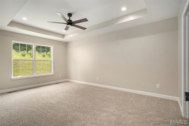 684 Fox Creek Dr, Fenton, MO 63026 - carpeted spare room featuring a raised ceiling, a ceiling fan, and recessed lighting