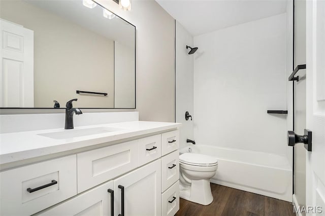 684 Fox Creek Dr, Fenton, MO 63026 - bathroom featuring vanity, wood finished floors, and bathing tub / shower combination