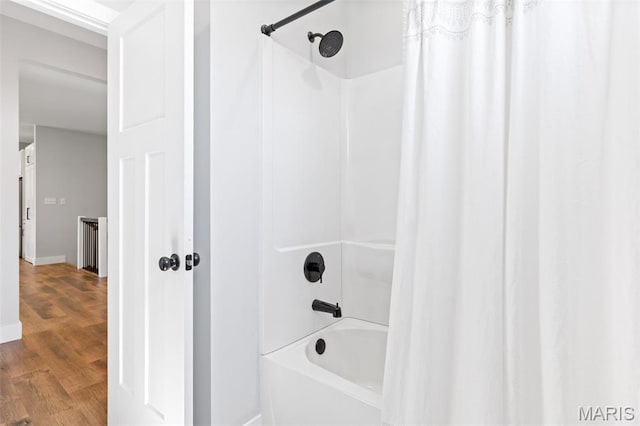 10523 Village Ln, Foristell, MO 63348 - full bath with shower / bathtub combination with curtain and wood finished floors
