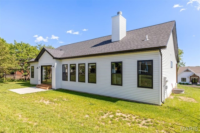 10523 Village Ln, Foristell, MO 63348 - back of property featuring a chimney, a lawn, and roof with shingles