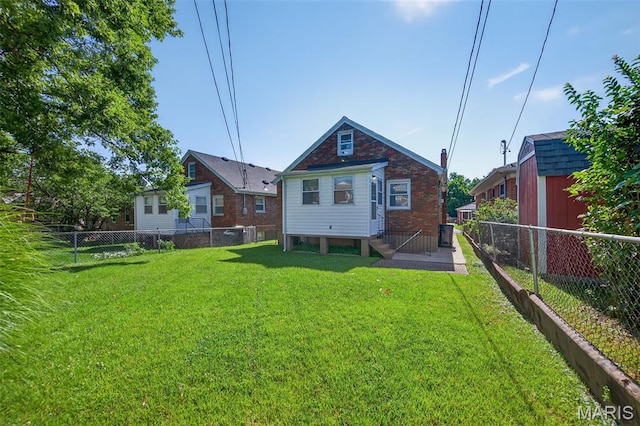 5021 Hi View Ave, Shrewsbury, MO 63119 - rear view of house with entry steps and a fenced backyard