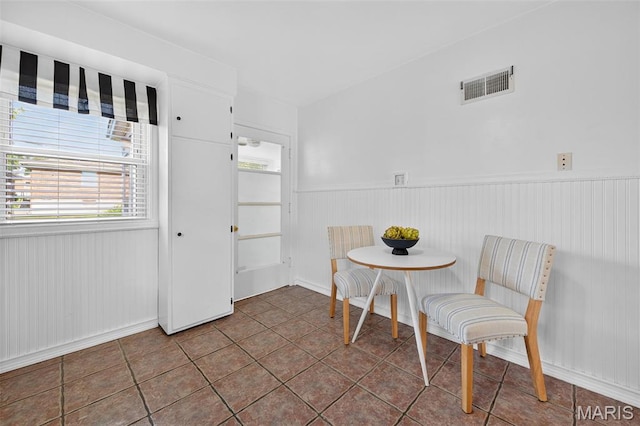 5021 Hi View Ave, Shrewsbury, MO 63119 - dining space featuring a wainscoted wall and tile patterned floors