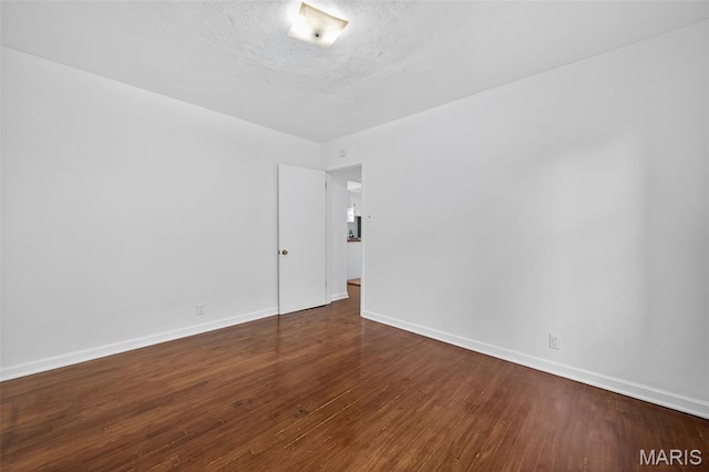 5021 Hi View Ave, Shrewsbury, MO 63119 - spare room with wood finished floors and baseboards