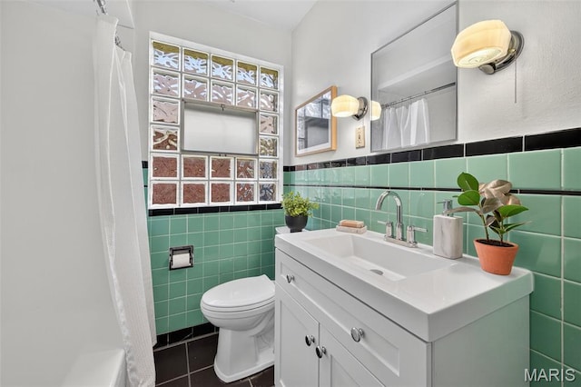 5021 Hi View Ave, Shrewsbury, MO 63119 - bathroom with tile walls, tile patterned flooring, vanity, a shower with curtain, and a wainscoted wall