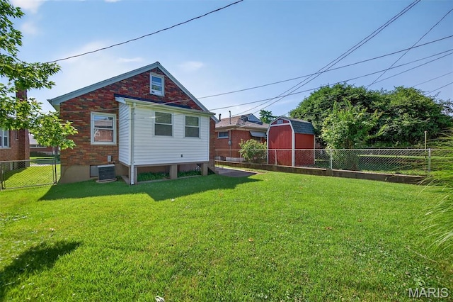 5021 Hi View Ave, Shrewsbury, MO 63119 - rear view of house with a fenced backyard and a storage unit