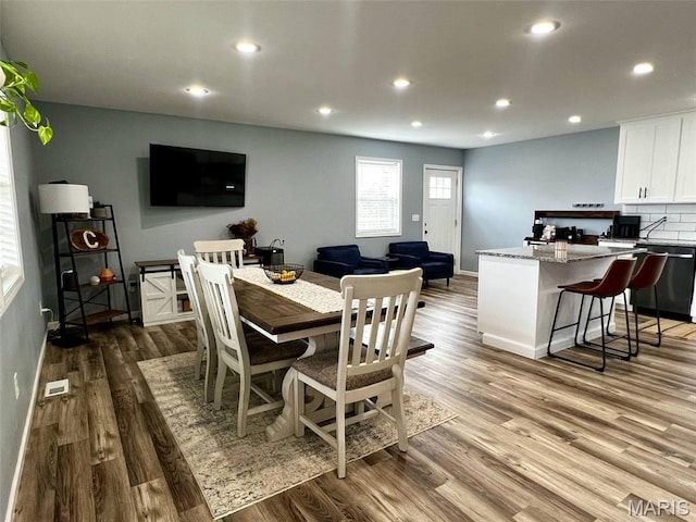 320 N Dickerson St, Palmyra, MO 63461 - dining space featuring wood finished floors and recessed lighting