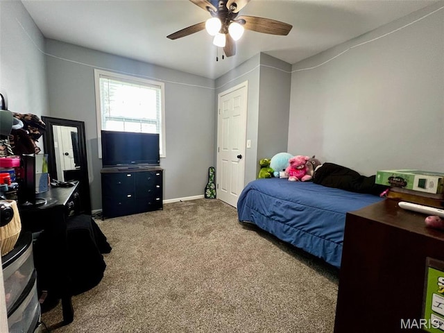 320 N Dickerson St, Palmyra, MO 63461 - carpeted bedroom with ceiling fan and baseboards