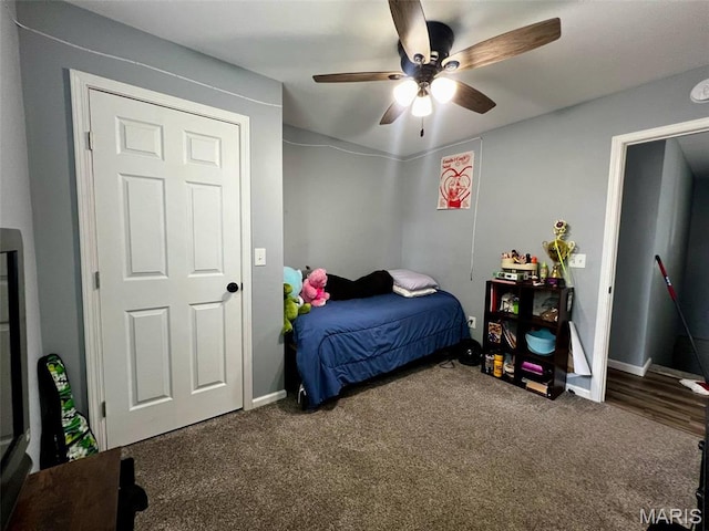 320 N Dickerson St, Palmyra, MO 63461 - carpeted bedroom featuring baseboards and ceiling fan