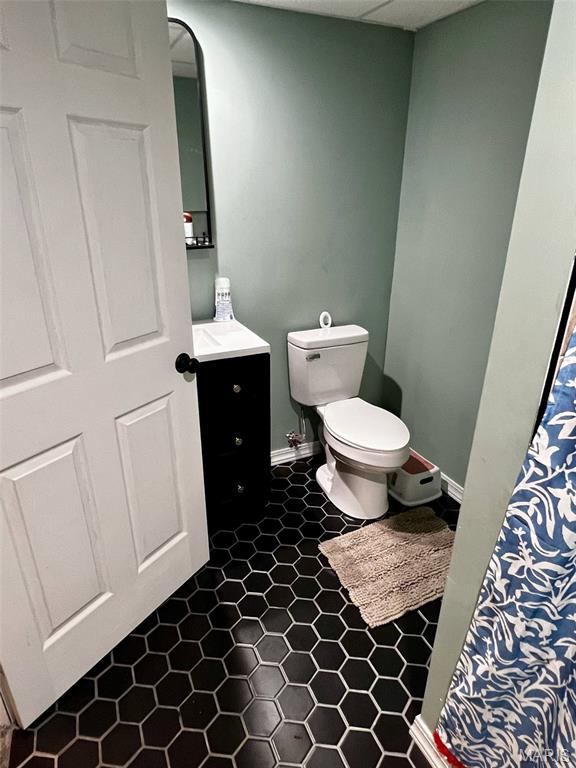 320 N Dickerson St, Palmyra, MO 63461 - bathroom with toilet and vanity