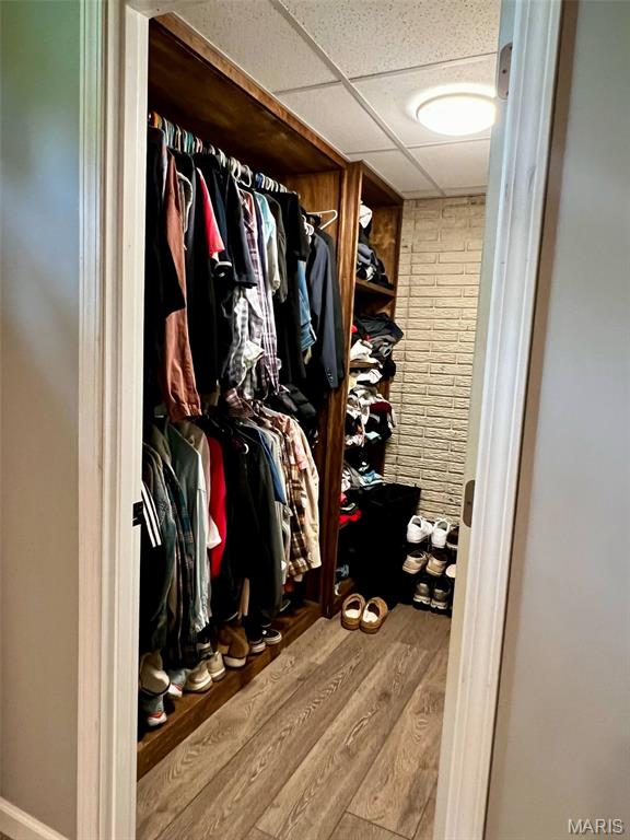 320 N Dickerson St, Palmyra, MO 63461 - walk in closet featuring a paneled ceiling and wood finished floors