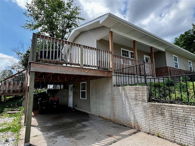 320 N Dickerson St, Palmyra, MO 63461 - view of home's exterior with brick siding and driveway