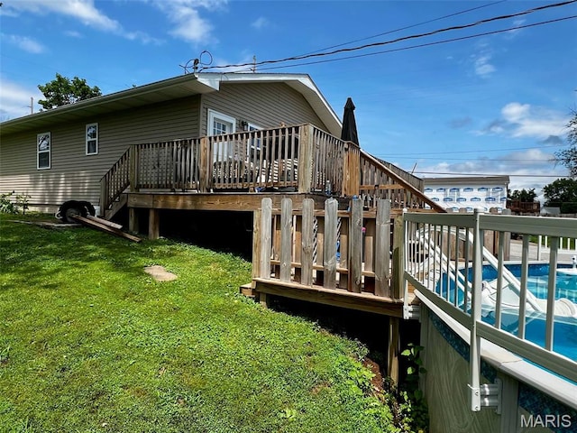 320 N Dickerson St, Palmyra, MO 63461 - rear view of property with a deck, stairway, and a yard