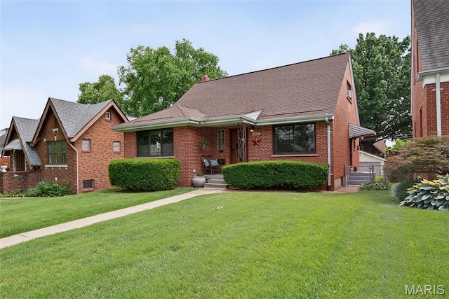 6580 Oleatha Ave, Saint Louis, MO 63139 - view of front of home featuring brick siding, a front lawn, and roof with shingles
