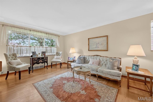 6580 Oleatha Ave, Saint Louis, MO 63139 - living area featuring light wood-type flooring and baseboards