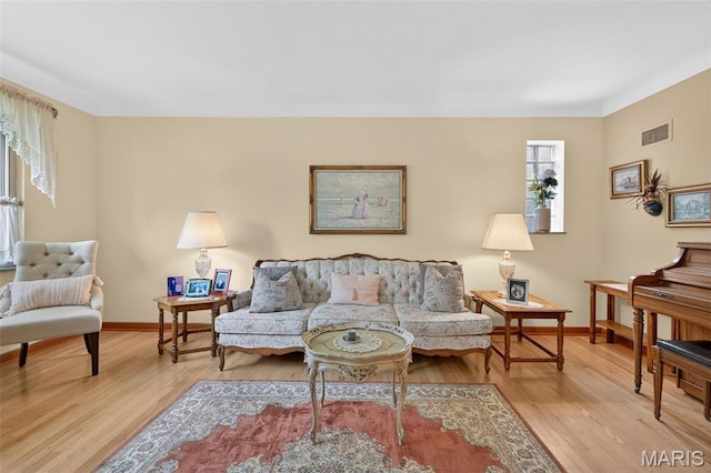 6580 Oleatha Ave, Saint Louis, MO 63139 - living area with baseboards and wood finished floors