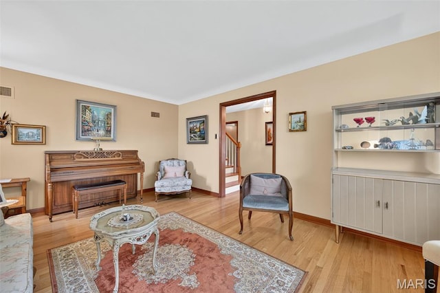 6580 Oleatha Ave, Saint Louis, MO 63139 - living room with wood finished floors and stairs