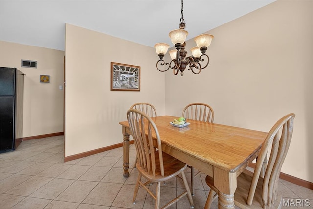 6580 Oleatha Ave, Saint Louis, MO 63139 - dining room with a chandelier and light tile patterned flooring