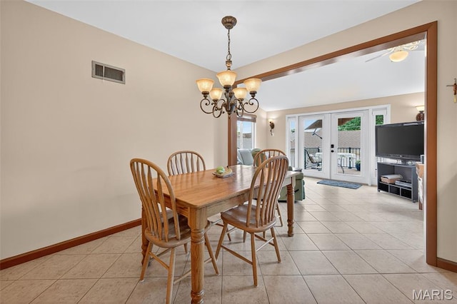 6580 Oleatha Ave, Saint Louis, MO 63139 - dining area with french doors, a chandelier, and light tile patterned floors