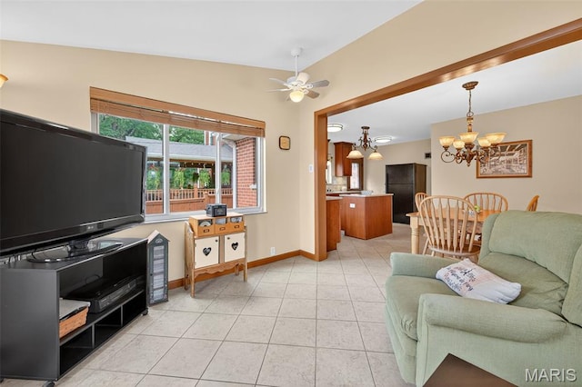 6580 Oleatha Ave, Saint Louis, MO 63139 - living area with a chandelier, light tile patterned floors, and a ceiling fan