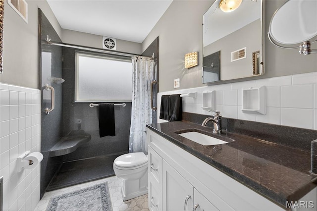 6580 Oleatha Ave, Saint Louis, MO 63139 - full bath with tile walls, curtained shower, vanity, wainscoting, and tile patterned floors