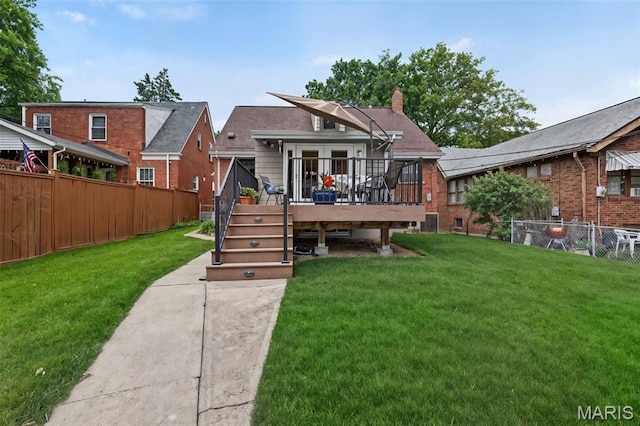 6580 Oleatha Ave, Saint Louis, MO 63139 - back of house featuring a fenced backyard, a wooden deck, and a chimney