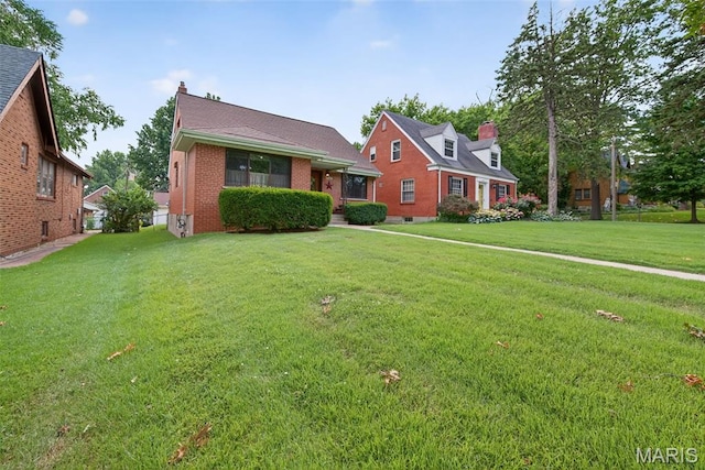 6580 Oleatha Ave, Saint Louis, MO 63139 - view of front of property featuring a front yard and brick siding
