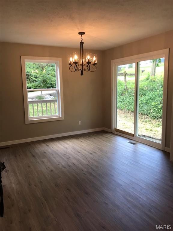 522 Judith Ann Pl, Fairview Heights, IL 62208 - empty room with a chandelier and dark wood finished floors