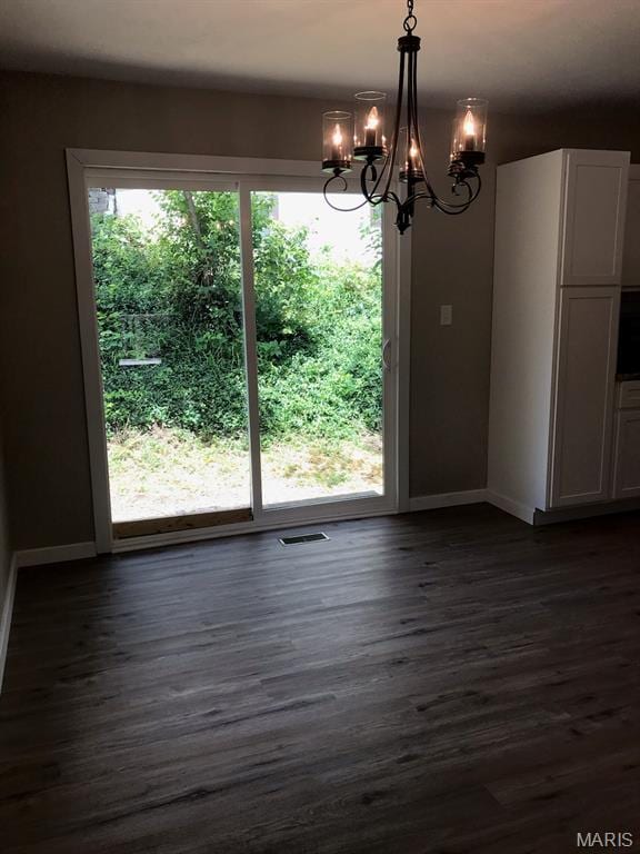 522 Judith Ann Pl, Fairview Heights, IL 62208 - unfurnished dining area with a chandelier and dark wood finished floors