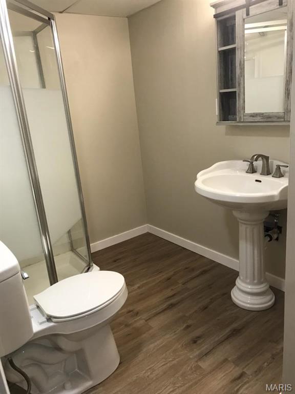 522 Judith Ann Pl, Fairview Heights, IL 62208 - full bathroom with a shower stall and wood finished floors