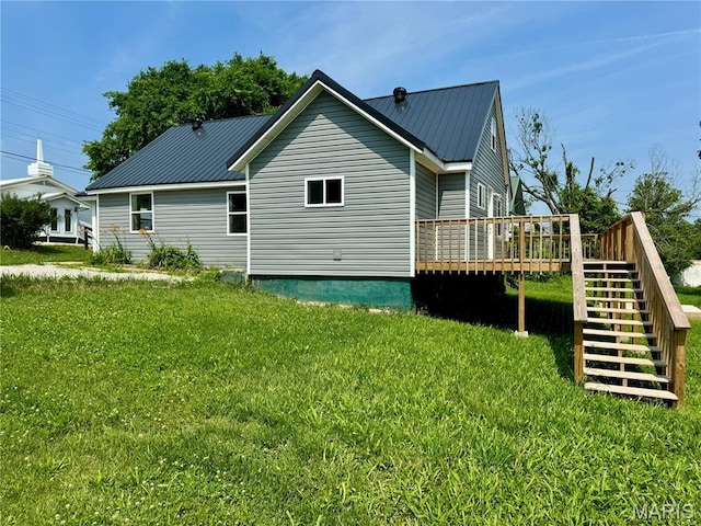 401 Clara St, Potosi, MO 63664 - view of property exterior featuring a deck, stairway, a yard, and a metal roof