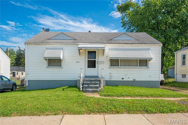 8143 Airport Rd, Berkeley, MO 63134 - bungalow-style house featuring entry steps, a front yard, and roof with shingles