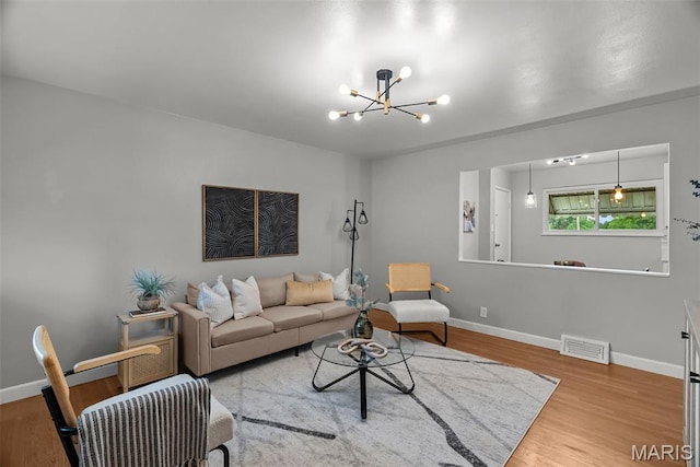 4231 Green Park Rd, Saint Louis, MO 63125 - living area with a chandelier and wood finished floors