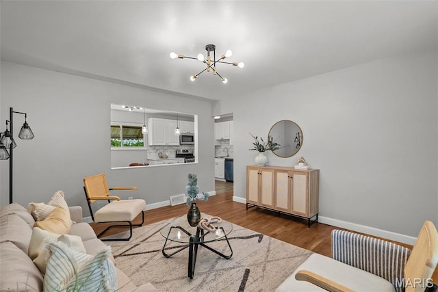 4231 Green Park Rd, Saint Louis, MO 63125 - living room with a chandelier and dark wood-style floors