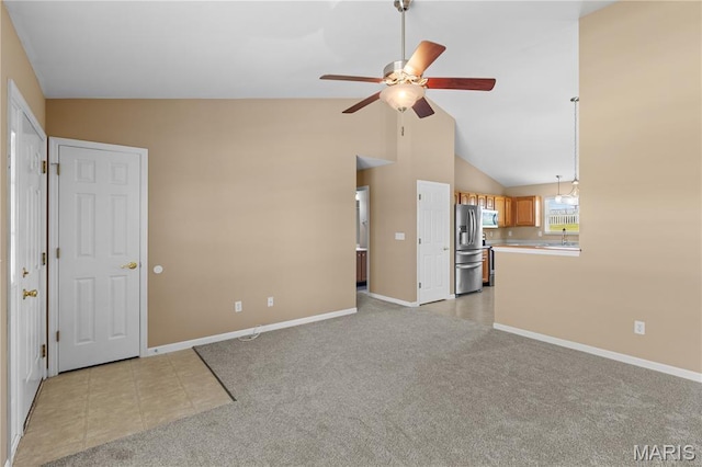 925 Stone Crossing Dr, Wentzville, MO 63385 - unfurnished living room with ceiling fan, light colored carpet, and vaulted ceiling