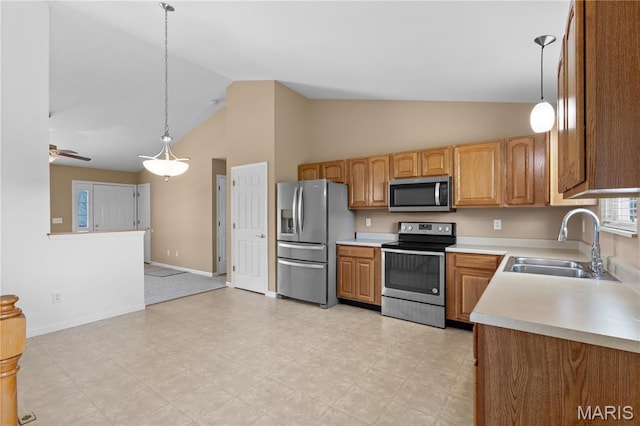 925 Stone Crossing Dr, Wentzville, MO 63385 - kitchen with appliances with stainless steel finishes, light countertops, pendant lighting, high vaulted ceiling, and a ceiling fan