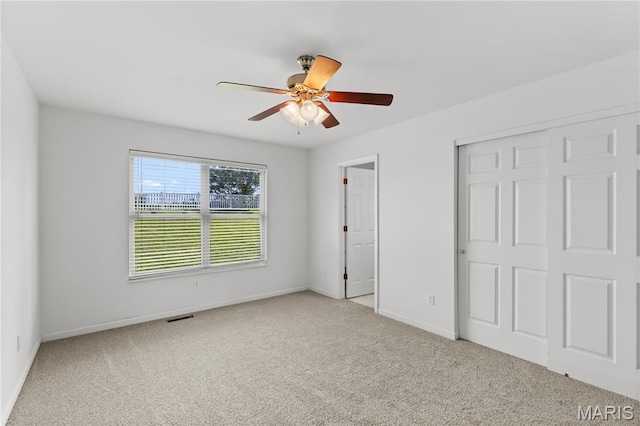 925 Stone Crossing Dr, Wentzville, MO 63385 - unfurnished bedroom with carpet, a closet, and a ceiling fan