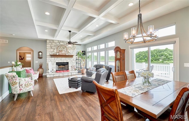10234 Village Dr, Foristell, MO 63348 - dining area with ceiling fan, a chandelier, dark wood-style floors, coffered ceiling, and a fireplace