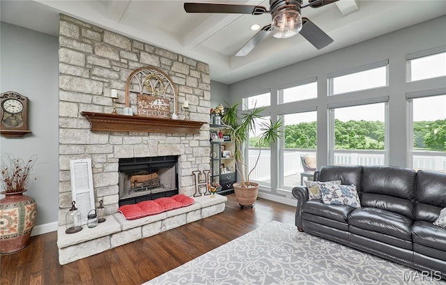 10234 Village Dr, Foristell, MO 63348 - living room with ceiling fan, beamed ceiling, plenty of natural light, and hardwood / wood-style floors