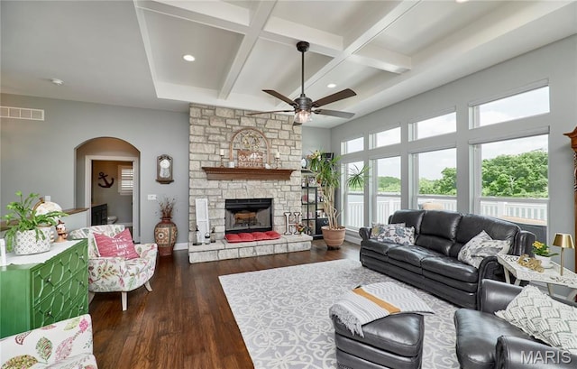 10234 Village Dr, Foristell, MO 63348 - living room with a ceiling fan, arched walkways, recessed lighting, dark wood finished floors, and beam ceiling