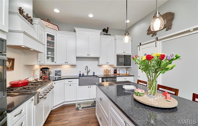 10234 Village Dr, Foristell, MO 63348 - kitchen featuring stainless steel gas cooktop, dark wood finished floors, white cabinetry, pendant lighting, and recessed lighting