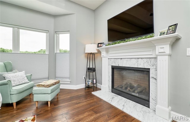 10234 Village Dr, Foristell, MO 63348 - sitting room with a high end fireplace and wood finished floors