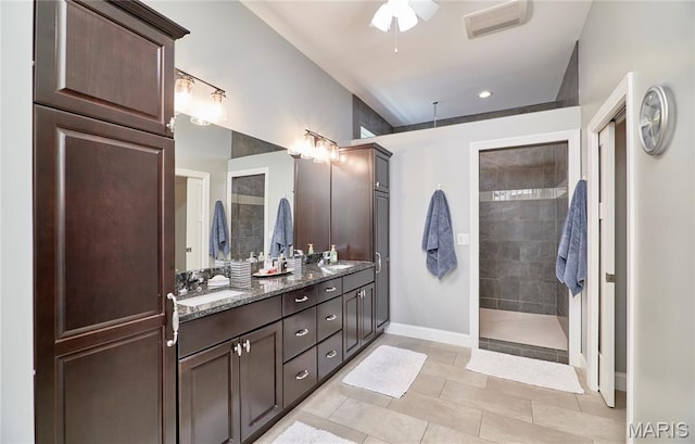 10234 Village Dr, Foristell, MO 63348 - full bathroom with double vanity, a ceiling fan, a walk in shower, tile patterned flooring, and recessed lighting
